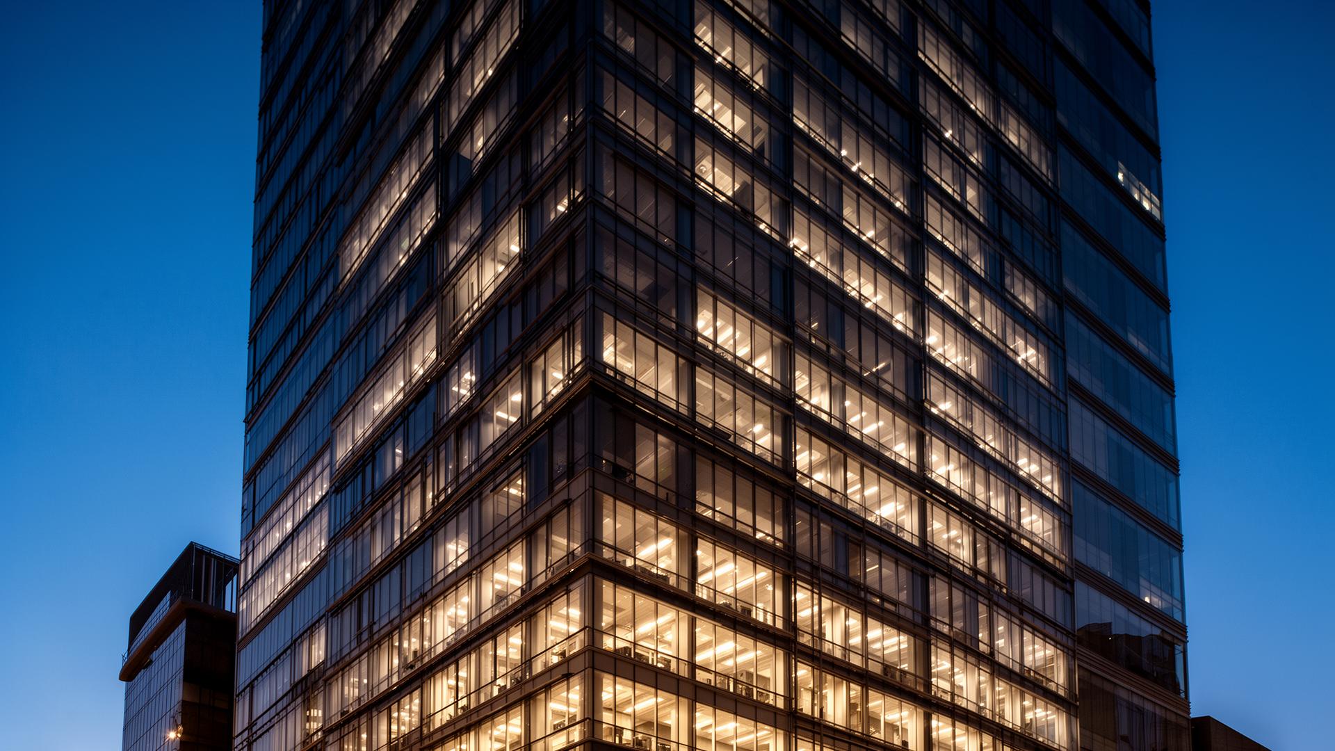 Modern commercial high-rise at dusk